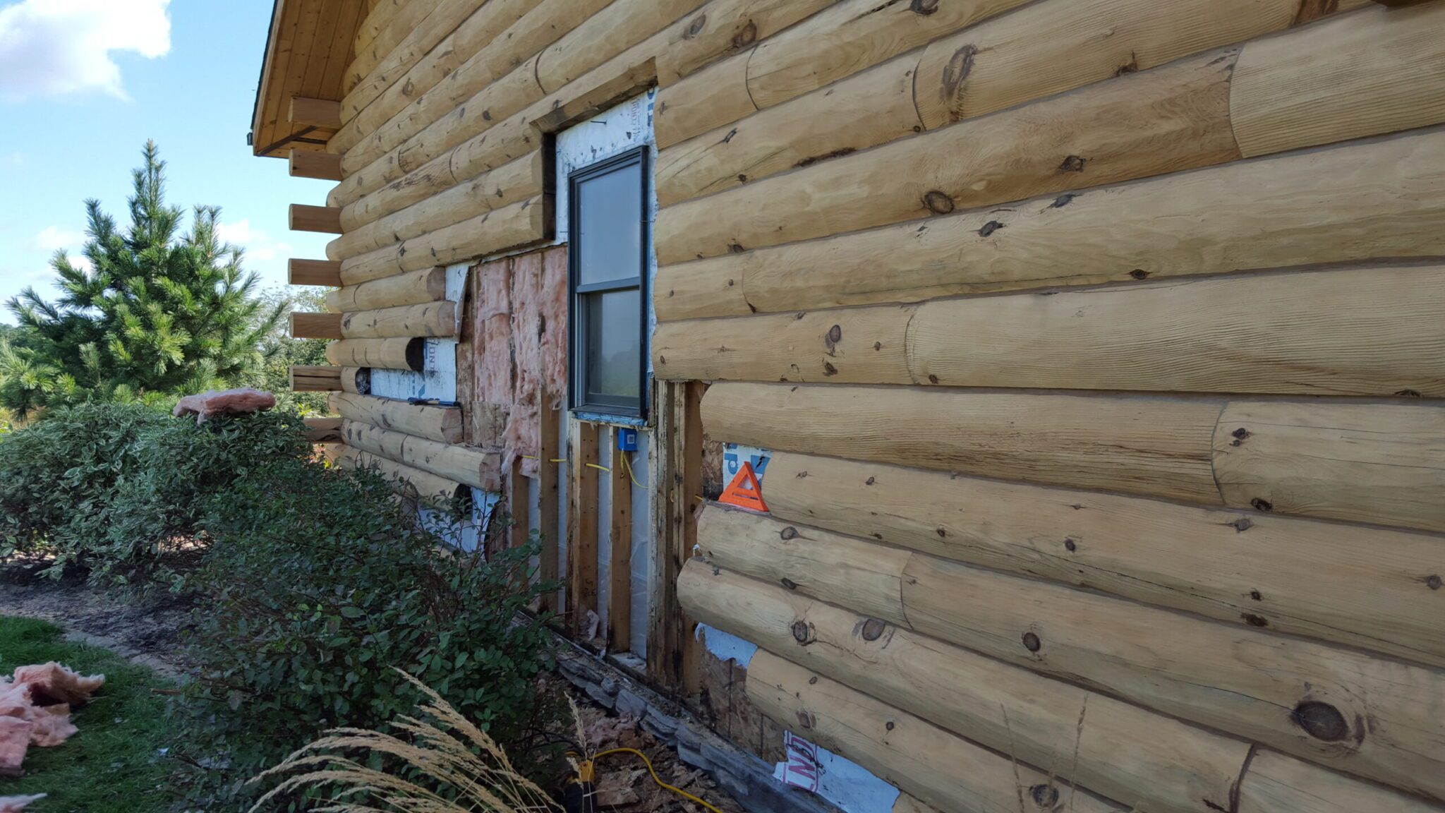 log rot under the windows near landscaping