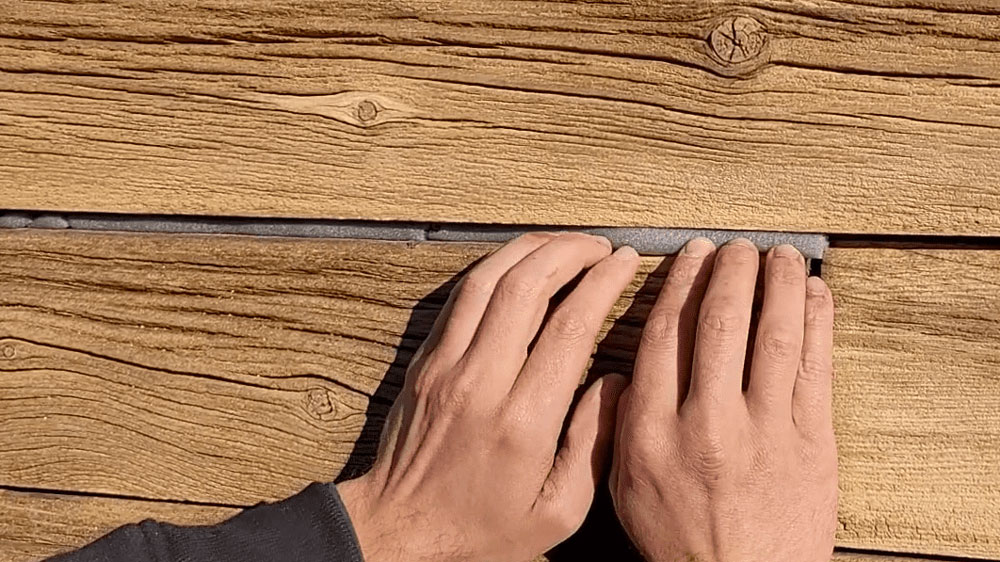 Log Masters Restorations Removing Nailed in Mortar and Wire Chinking with Hammer and Chisel