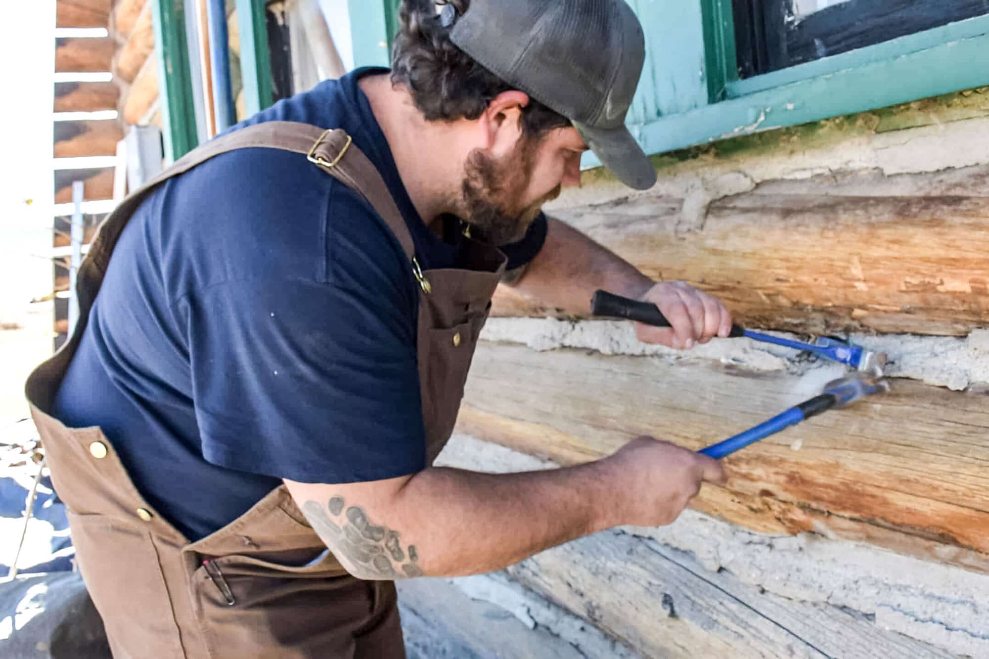 Log Masters Restorations Removing Nailed in Mortar and Wire Chinking with Hammer and Chisel