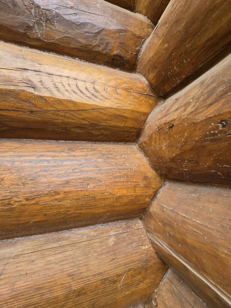 Slight issues with chinking or caulking on a rental cabin that should be addressed before summer