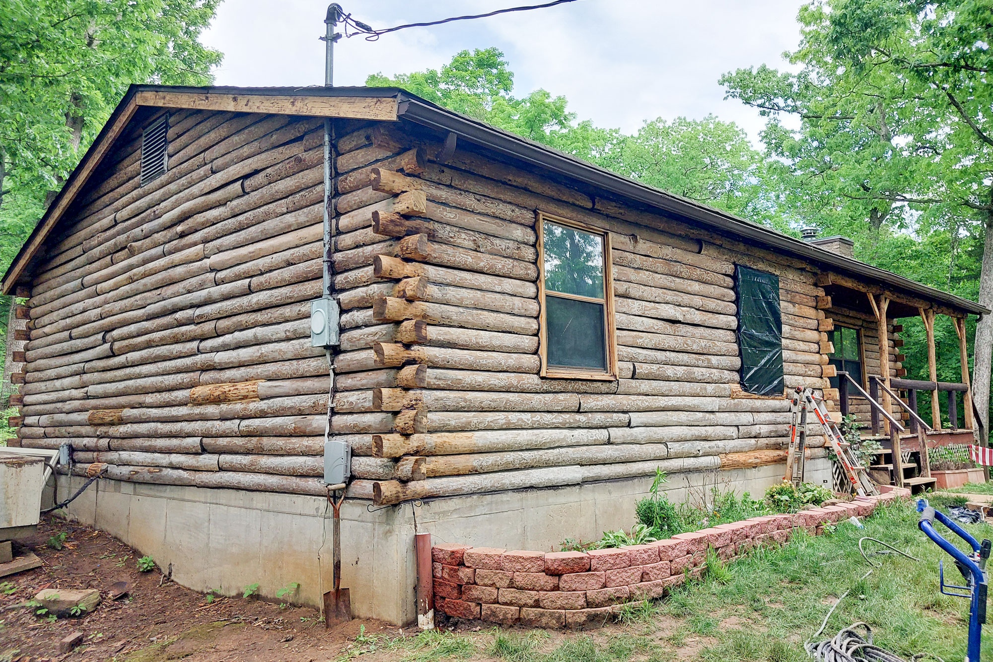 This image is of a 3 story log home that was recently media blasted exposing the wood log surfaces by Log Masters Restorations. The captions on the pictures say, "Repeat borate treatment every 6 years is recommended. Borate Wood Treatment has been one of the most effective and popular choices in pest management for over 25 years." Log Masters Restorations Trademark is in the bottom right corner.